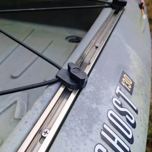 Close-up of a kayak with 'Ghost' branding and a camera metadata overlay at the bottom.