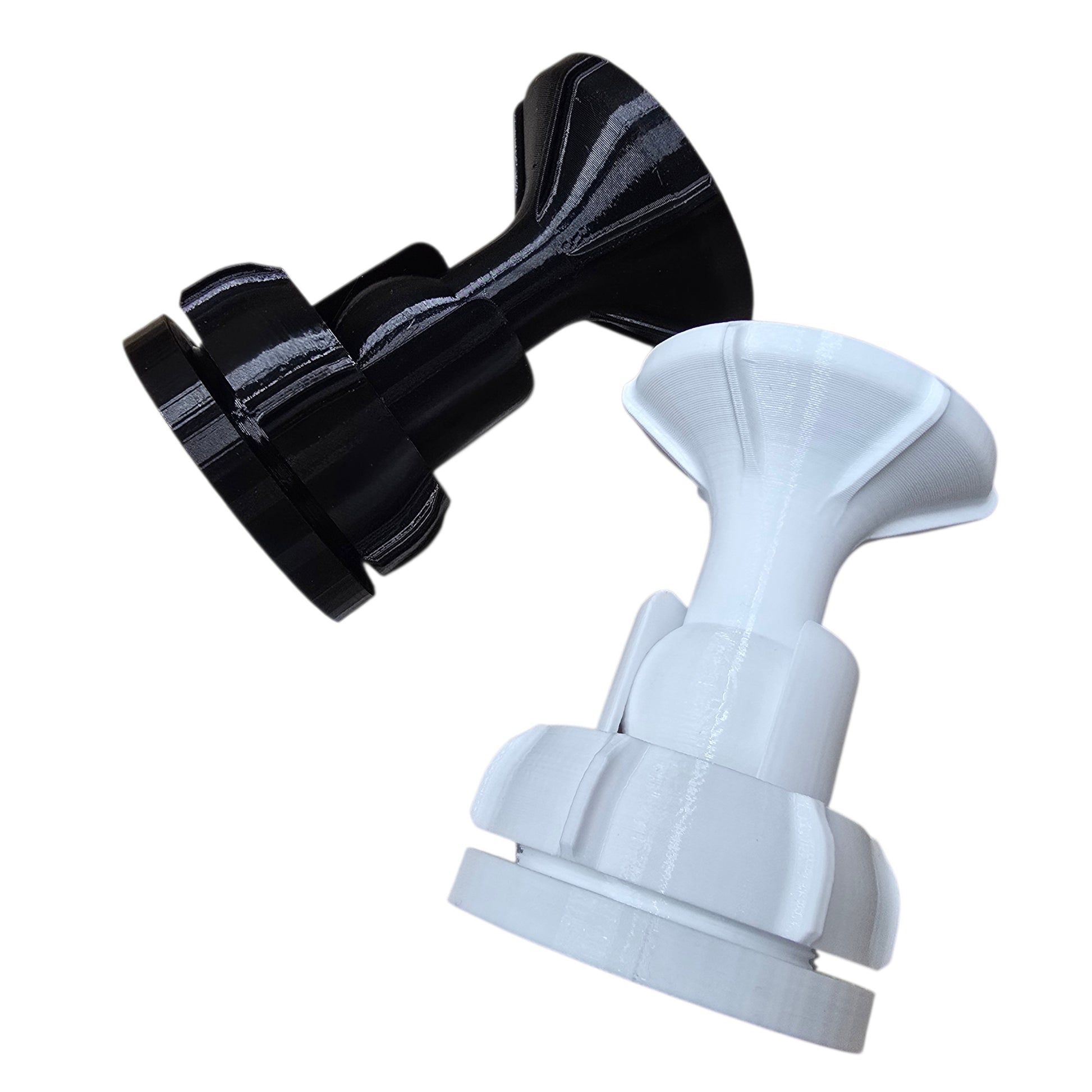 Black and white suction cup attachments on a white background