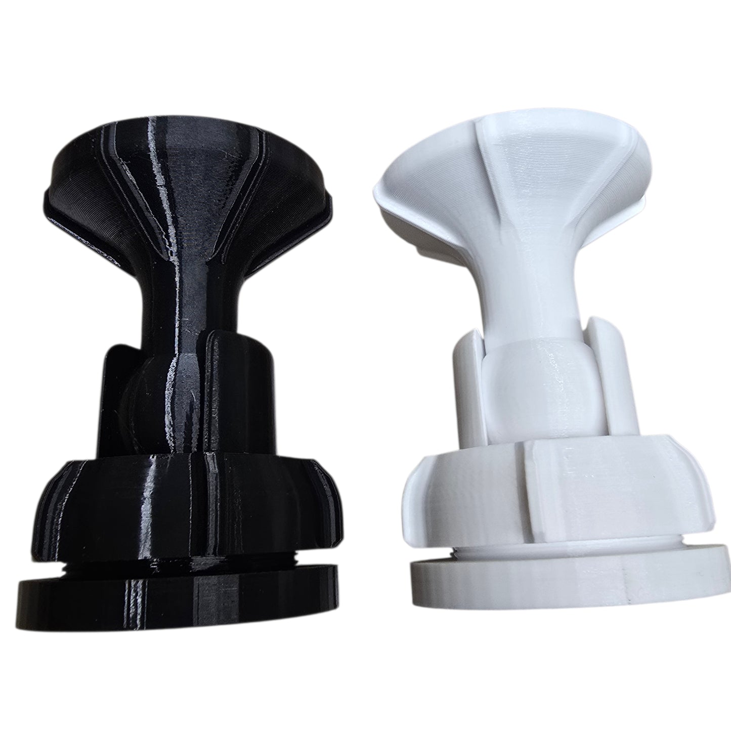 Black and white suction cup holders on a white background